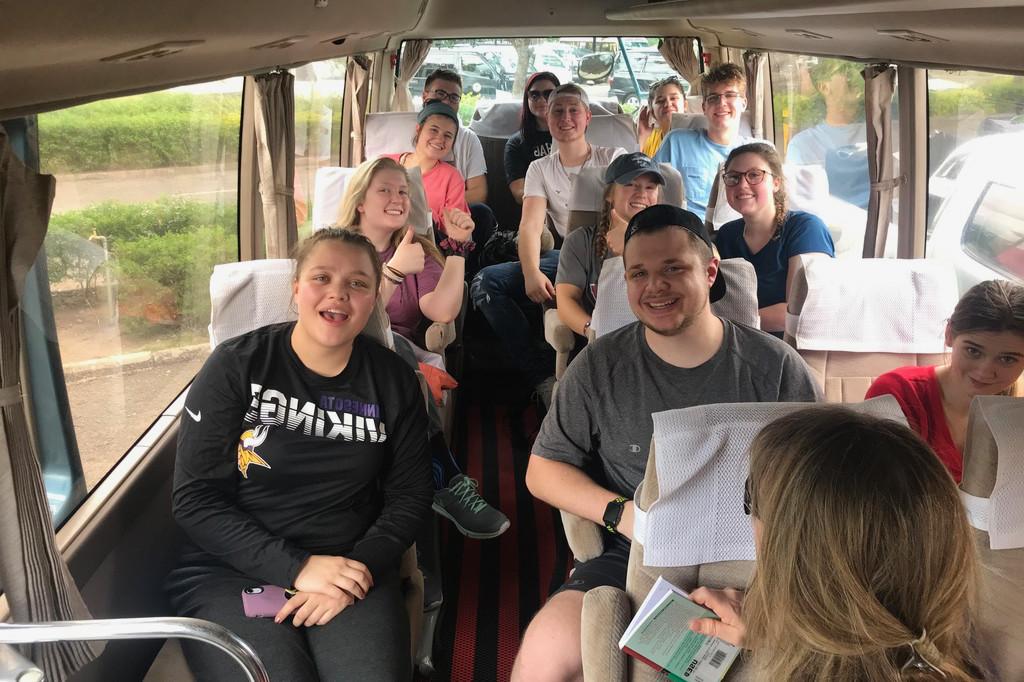 Students on a bus, ready for a day of exploration in Tanzania!