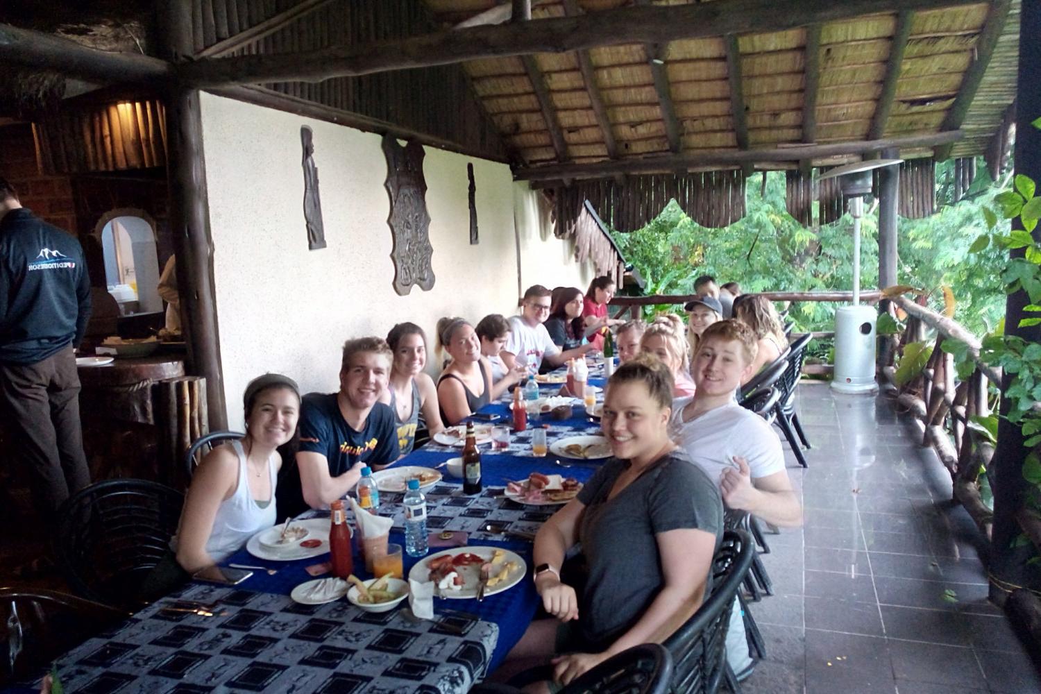 Students on the Tanzania study tour during a meal.